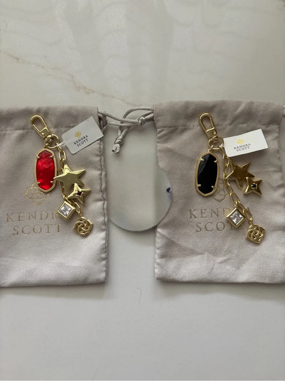 KENDRA SCOTT women's game day bag charm in gold with red or black stone NWT